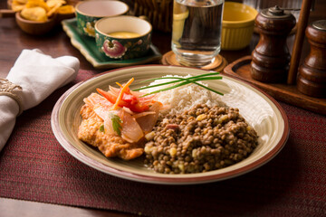 Escabeche fried fish with onions and lentils stew white rice Buffet table Peruvian comfort restaurant gourmet food