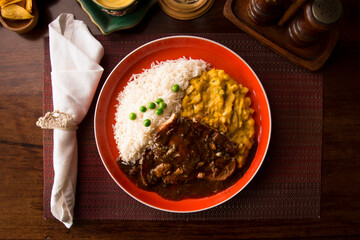 Fried cow liver with locro pumpkin stew Buffet table Peruvian comfort restaurant gourmet food