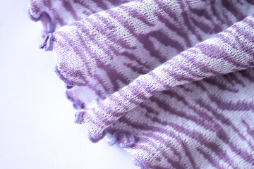 Fototapeta na wymiar 虎模様（縞模様）の布の背景(紫と白）