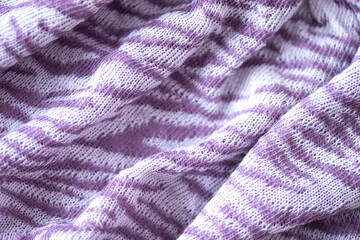 Fototapeta na wymiar 虎模様（縞模様）の布の背景(薄紫と白）