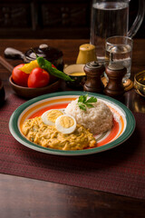 Aji de gallina chicken cream boiled eggs Peruvian comfort restaurant gourmet food