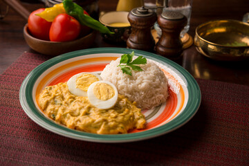 Aji de gallina chicken cream boiled eggs Peruvian comfort restaurant gourmet food