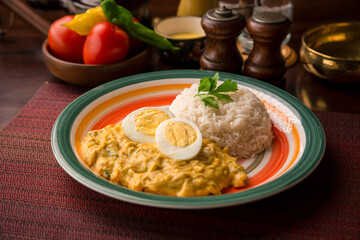 Aji de gallina chicken cream boiled eggs Peruvian comfort restaurant gourmet food