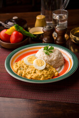 Aji de gallina chicken cream boiled eggs Peruvian comfort restaurant gourmet food
