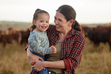 Mother and daughter, love and family on a farm as a cattle farmer and child in the farming or...