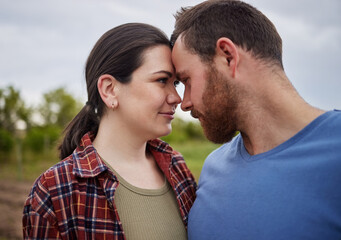 Love, freedom and happy couple in countryside, nature park or farm with field growth in spring environment. Man, woman and romance on a relax, sustainability and agriculture farmer date