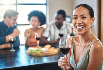 Social, happy and wine of a woman with a glass of alcohol at a dinner table with friends in a...
