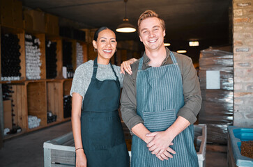 Ceo, wine people or couple and store workers in their distillery cellar background. Portrait, man and woman winery employees with happy smile working at warehouse, factory or vineyard industry
