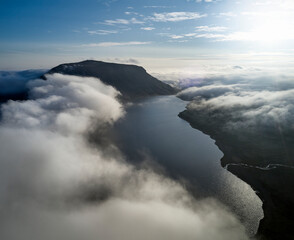 Clouds over mountains and sea