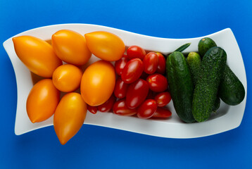 fresh and tasty vegetables on a white dish