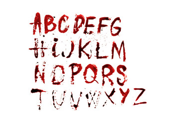 bloody alphabet.Letters abs with streaks and blood stains .Halloween alphabet. Letters written in...