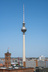The famous TV Tower and the red town hall in Berlin on a sunny day