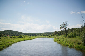 Obraz premium River in nature on a summer day, early in the morning