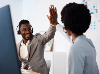 Customer service, call center and high five between colleagues celebrating a sale, reaching target or success at desk. Telemarketing agents or operators offering support, motivation and good service