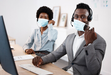 Customer service workers with protection from covid, mask and good hygiene. Online, call center or IT hotline support employees with headset, social distancing in corona virus pandemic or lockdown