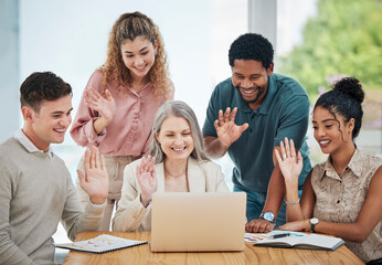 Fototapeta premium Diversity, creative and corporate team on a video call while greeting a colleague on a laptop. Team waving at coworker on online zoom meeting. Business people networking on a webinar to do teamwork.