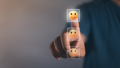 Feedback rating concept, Man choosing smiley face icon. feedback rating and positive customer review experience, business man select happy on satisfaction evaluation. Customer service and Satisfaction