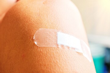 Medical adhesive plaster to stick wound on shoulder, arm, wound healing guidelines.