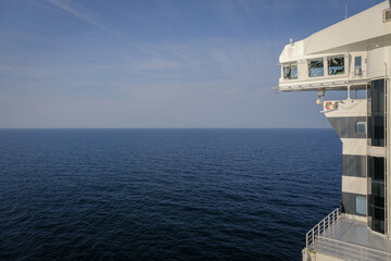 View from open outdoor deck of legendary luxury ocean liner cruise ship on passage during...