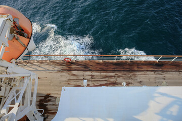 View from open outdoor deck of legendary luxury ocean liner cruise ship on passage during...