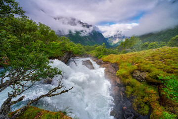Mountain river with a waterfall in the mountains, Stryn area, Norway