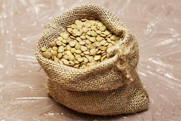 lentil grains in a canvas bag on the table