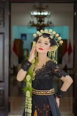 Portrait of a woman with Indonesian bridal makeup..
