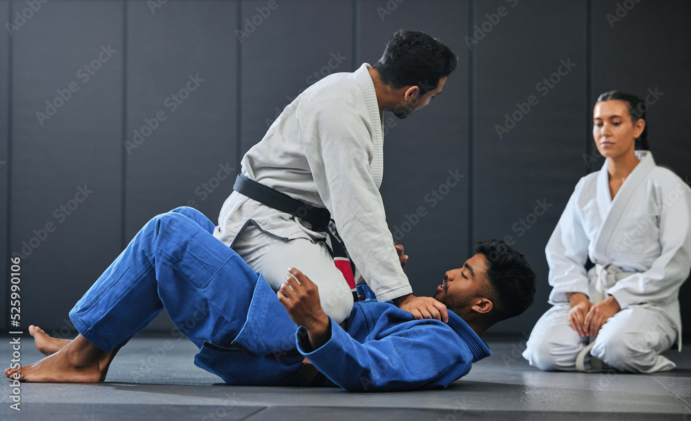 Sticker Karate, fitness and martial arts instructor teaching a lesson on fighting and defense training at a gym or indoor center. Diverse sporty student learning how to be safe in an attack with tough coach