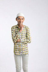 Indian muslim boy giving expression on white background.