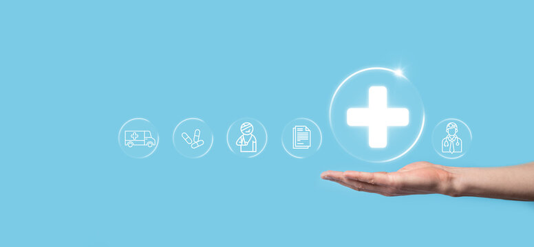 Businessman hold virtual plus medical network connection icons. Covid-19 pandemic develop people awareness and spread attention on their healthcare.Doctor,document,medicine,ambulance,patient icon.