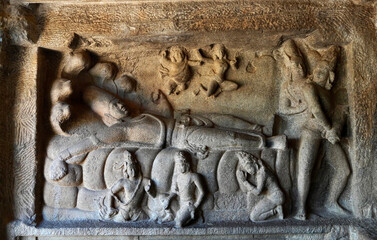 Bas relief of Lord Vishnu sculpture lying in the bed of Five headed snake is prominently carved in...