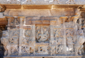 Indian rock art of bas relief sculptures of God, Animals carved in the monolithic rock cut cave temples in Mahabalipuram, Tamilnadu, India. Ancient historical relief sculptures in Tamilnadu.