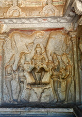 Indian rock art of bas relief sculptures of God, Animals carved in the monolithic rock cut cave temples in Mahabalipuram, Tamilnadu, India. Ancient historical relief sculptures in Tamilnadu.