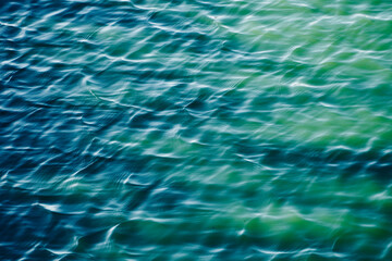 Sea water wave effect. Turquoise calm clean aqua surface. Blue rippling water. Minimalist. Sparkling water background. Texture effect wallpaper.