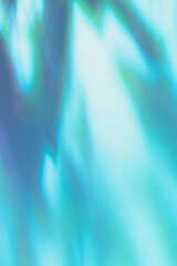 Abstract diagonal tree leaves shadows on mint blue wall texture. Abstract trendy colored nature light concept background. Copy space for text overlay, poster mockup, flat lay, top view