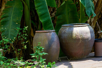 Close-up of large ceramic water tank outdoors