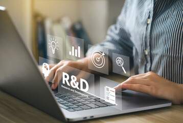 Women use a computer with the R and D icon for Research and Development on the laptop screen. R&D: Research and Development Business Science Technology Concept. Manage costs more efficiently.