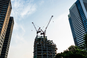 View of the building construction site with cranes in Taichung, Taiwan.