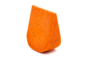 Red gouda cheese. Guoda cheese with sun-dried tomatoes and basil isolated on a white background. Dutch cheese. close up