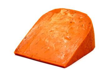 Red gouda cheese. Guoda cheese with sun-dried tomatoes and basil isolated on a white background. Dutch cheese. close up