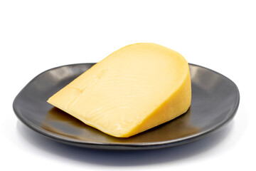 Yellow gouda cheese. Hard Dutch gouda cheese, isolated on white background. close up