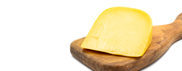 Yellow gouda cheese. Hard Dutch gouda cheese, isolated on white background. Copy space