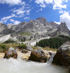 Plakat torrent that flows from the foothills of the Dolomites mountains in northern Italy