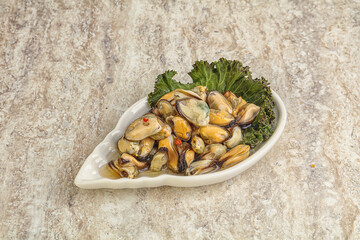 Tasty marinated mussels in the bowl