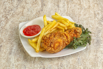 Crispy chicken leg with fry potato