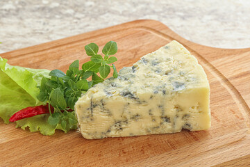 Blue cheese piece over board