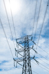 Silhouette of high voltage tower and electric line with the sky background