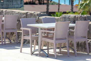 Plastic chairs and tables in a restaurant.