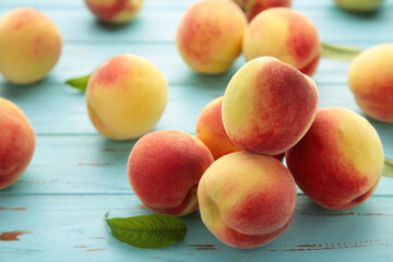 Fresh peaches on a old blue background. Space for text