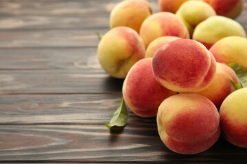 Fresh peaches on a old brown background. Space for text